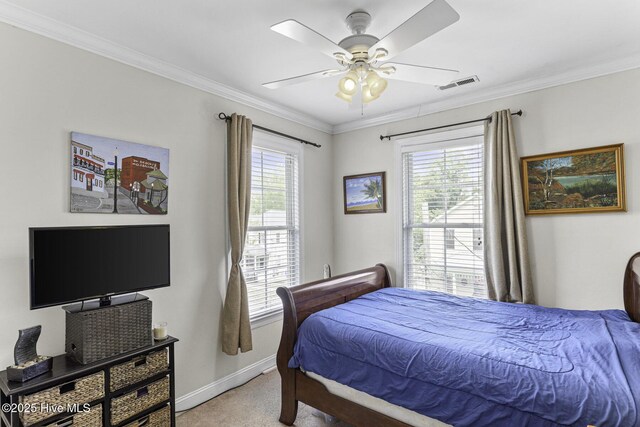 bedroom with light colored carpet, baseboards, visible vents, a ceiling fan, and crown molding