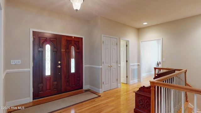 entrance foyer with visible vents, light wood-type flooring, recessed lighting, and baseboards