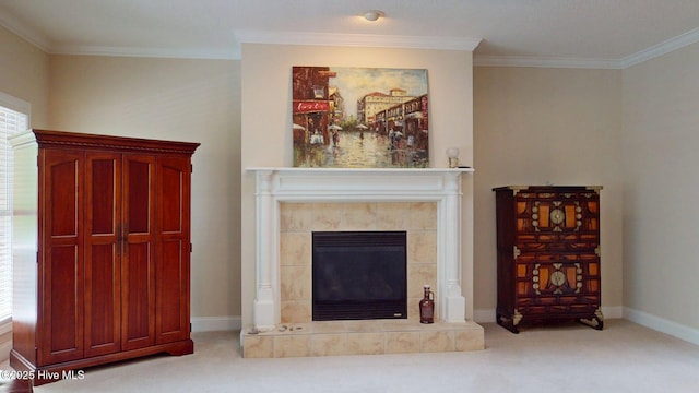carpeted living area featuring baseboards, a tile fireplace, and crown molding