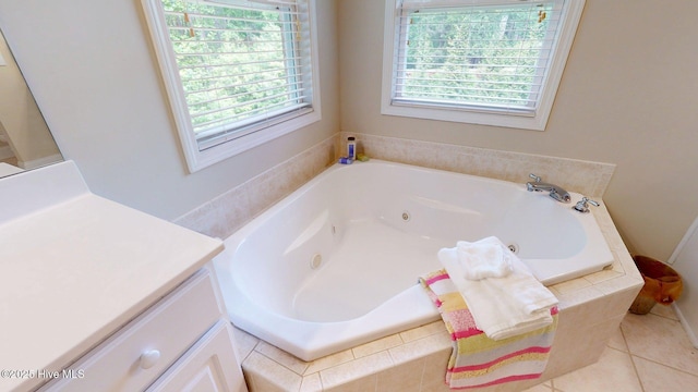 bathroom with vanity and a whirlpool tub