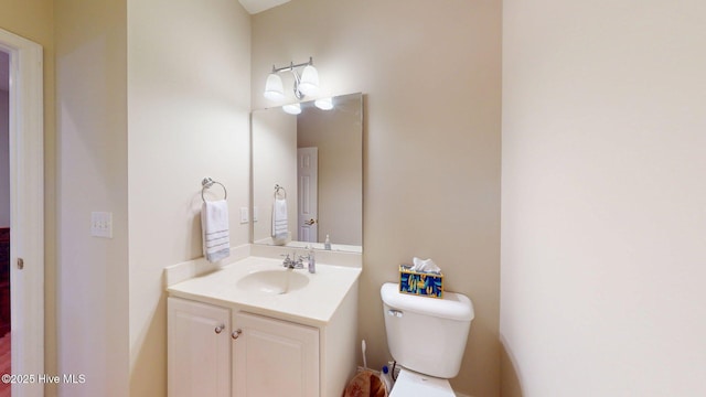half bath with toilet and vanity