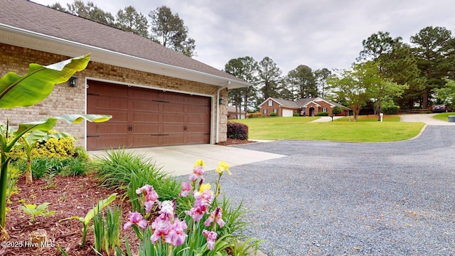 garage with gravel driveway