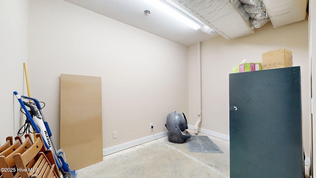 misc room featuring unfinished concrete floors