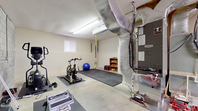 workout area featuring a textured ceiling