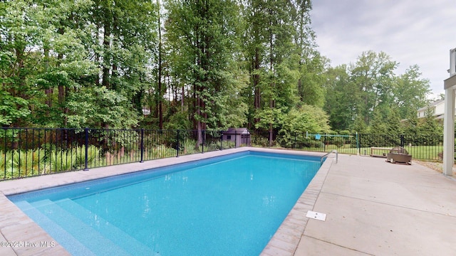 view of pool featuring fence, a patio area, and a fenced in pool