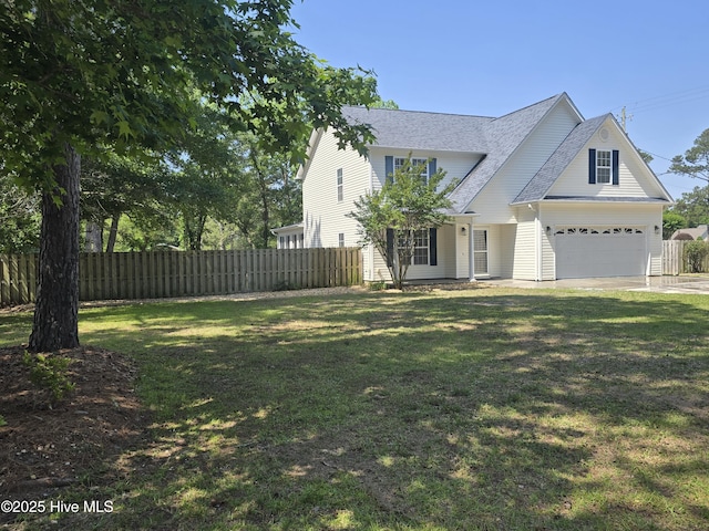 traditional-style home featuring concrete driveway and a garage