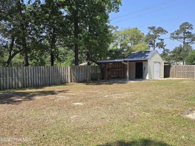 view of yard with an outbuilding and a storage shed