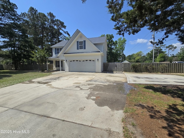 traditional-style house with concrete driveway
