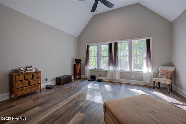 bedroom with wood finished floors, baseboards, and lofted ceiling