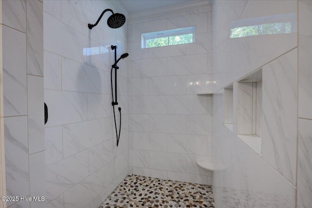 bathroom featuring tiled shower