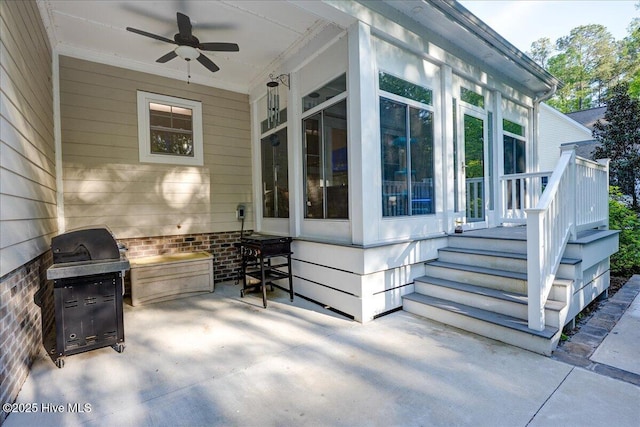 view of patio / terrace with ceiling fan, a sunroom, and area for grilling