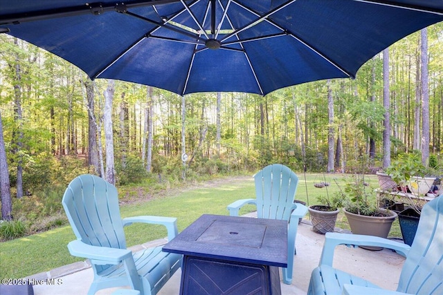 view of patio with a wooded view