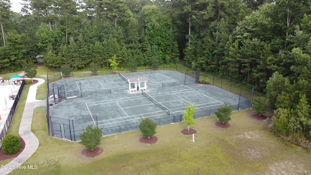 bird's eye view with a wooded view