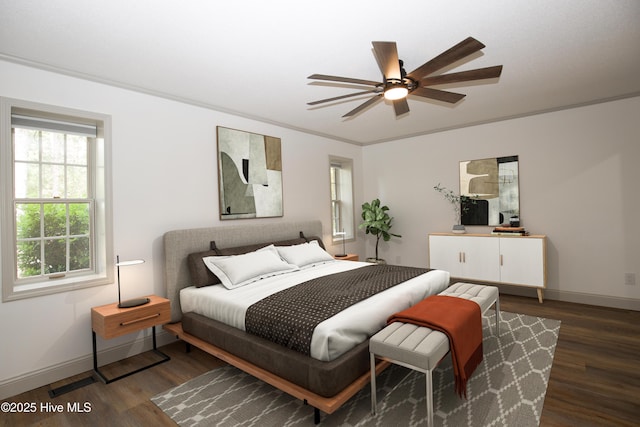 bedroom featuring baseboards, a ceiling fan, wood finished floors, and visible vents