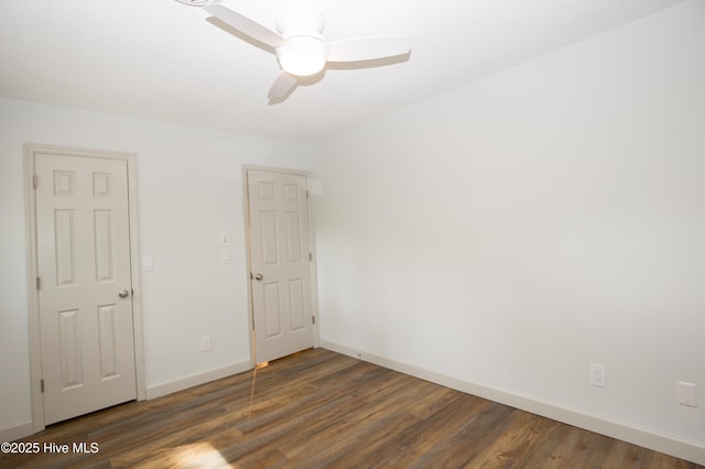 unfurnished room with baseboards, ceiling fan, and wood finished floors
