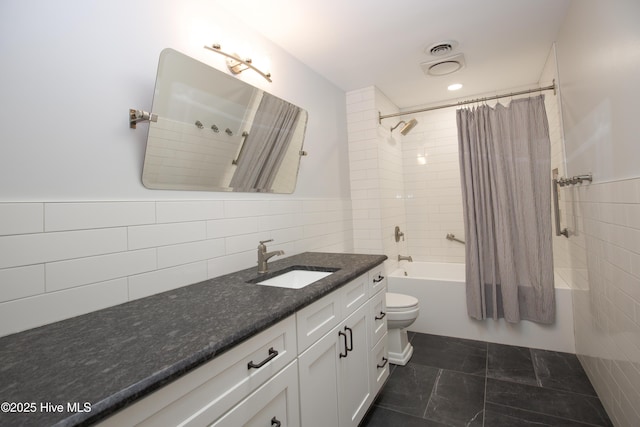 full bathroom featuring vanity, visible vents, toilet, tile walls, and shower / bathtub combination with curtain