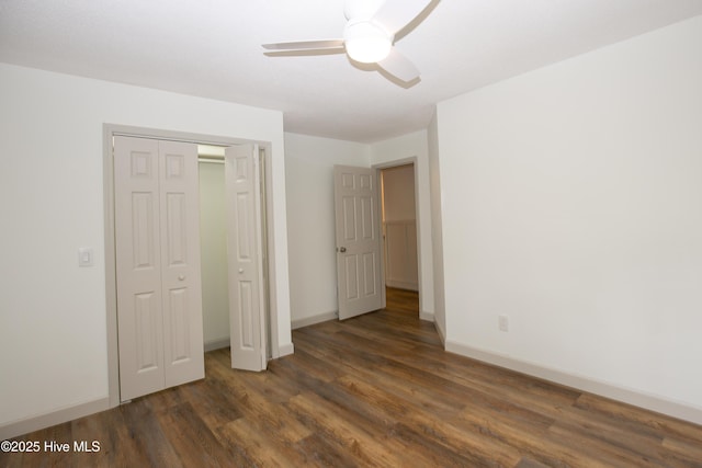 unfurnished bedroom with a closet, a ceiling fan, baseboards, and wood finished floors