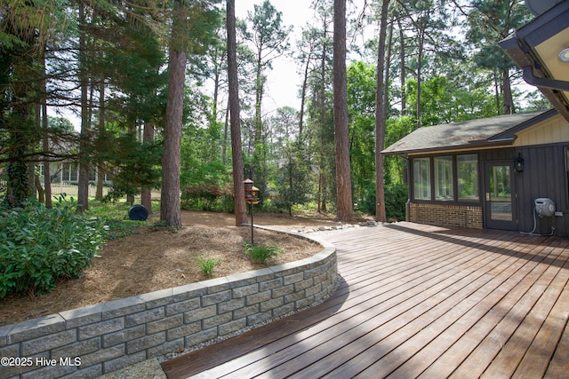 deck with a sunroom