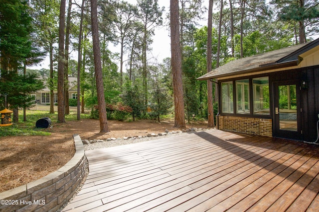 wooden terrace with a sunroom