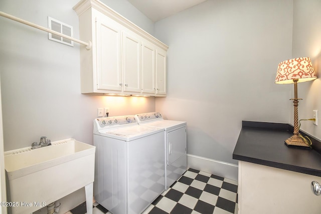 laundry area featuring cabinet space, washer and dryer, tile patterned floors, baseboards, and visible vents