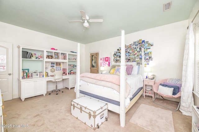 bedroom featuring ceiling fan, light colored carpet, and visible vents