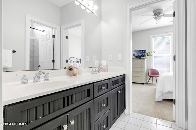 full bathroom with tile patterned floors, a ceiling fan, double vanity, and a sink