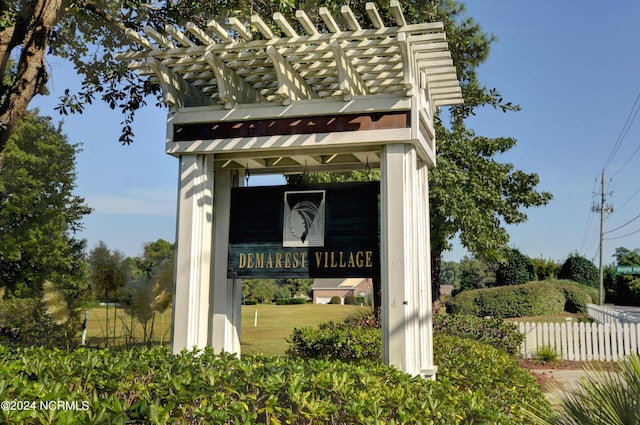 community sign with fence