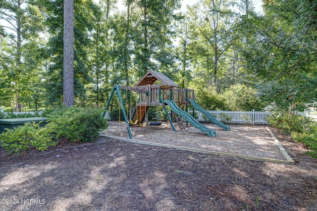 communal playground featuring fence