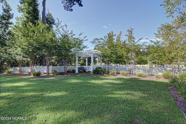 view of yard with fence private yard and a pergola