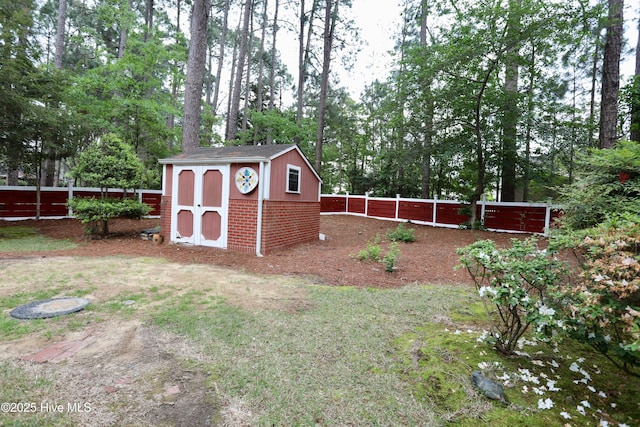21 Birdie Dr, Whispering Pines, NC 28327 - view of shed with a fenced backyard