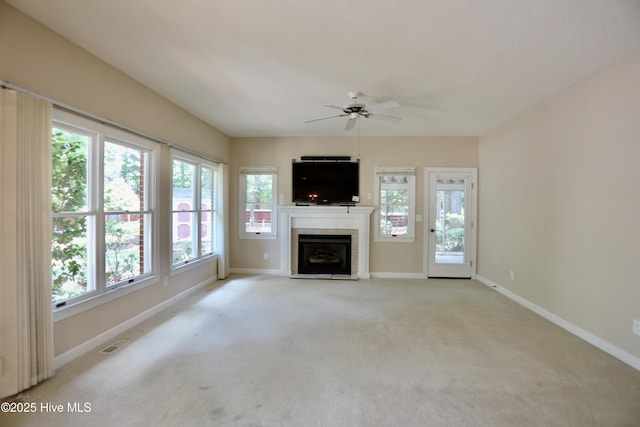 21 Birdie Dr, Whispering Pines, NC 28327 - unfurnished living room with a ceiling fan, baseboards, and a tile fireplace