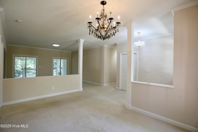 21 Birdie Dr, Whispering Pines, NC 28327 - carpeted spare room featuring decorative columns, baseboards, an inviting chandelier, and ornamental molding