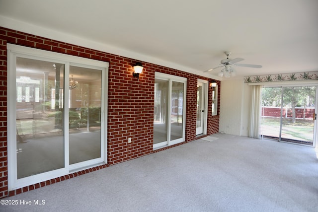 21 Birdie Dr, Whispering Pines, NC 28327 - unfurnished sunroom with a notable chandelier