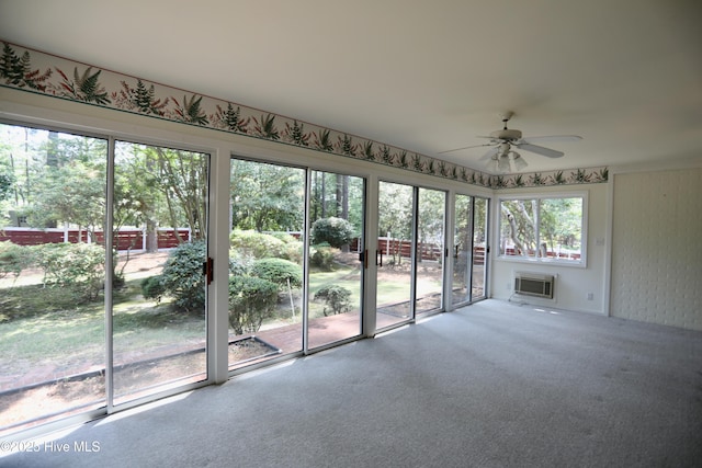 21 Birdie Dr, Whispering Pines, NC 28327 - unfurnished sunroom featuring a wall unit AC and a ceiling fan
