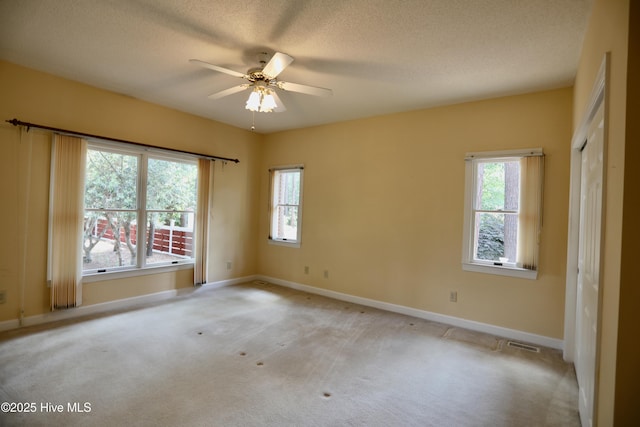 21 Birdie Dr, Whispering Pines, NC 28327 - empty room featuring baseboards, ceiling fan, a healthy amount of sunlight, and visible vents
