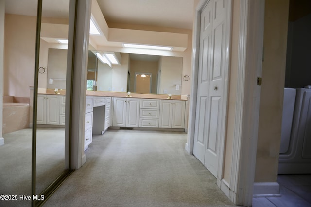 21 Birdie Dr, Whispering Pines, NC 28327 - full bathroom with a skylight, carpet floors, and vanity