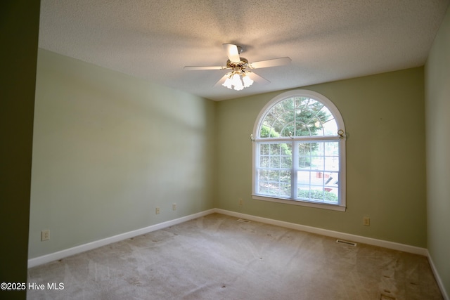 21 Birdie Dr, Whispering Pines, NC 28327 - empty room featuring ceiling fan, a textured ceiling, visible vents, carpet floors, and baseboards