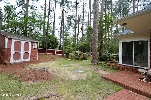 21 Birdie Dr, Whispering Pines, NC 28327 - view of yard featuring an outdoor structure, a shed, a patio, and fence