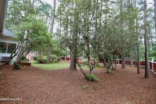 21 Birdie Dr, Whispering Pines, NC 28327 - view of yard with an outbuilding and a shed