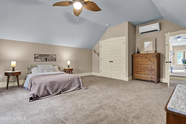bedroom featuring vaulted ceiling, a wall mounted AC, carpet floors, and a closet