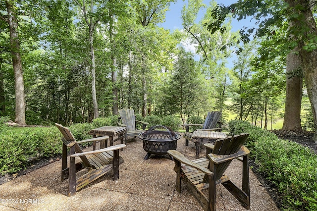 view of patio / terrace featuring an outdoor fire pit