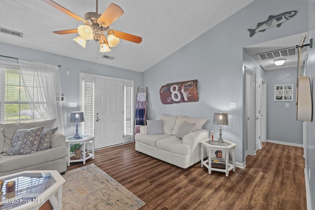 living room with wood finished floors and visible vents