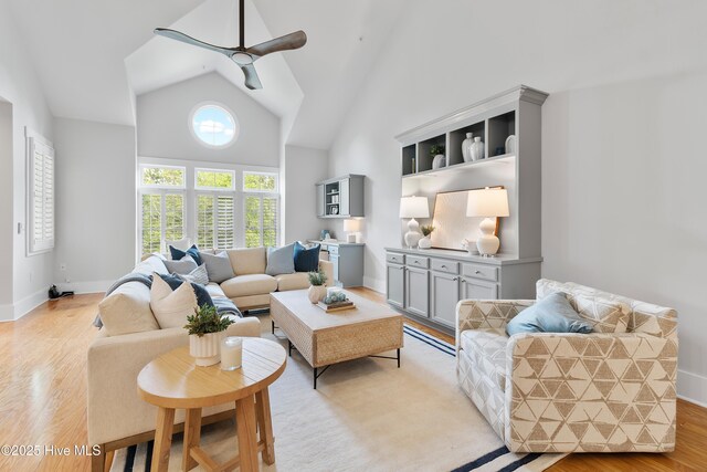 2537 St James Dr SE Apt 1011, Southport, NC 28461 - living area featuring baseboards, high vaulted ceiling, ceiling fan, and light wood finished floors