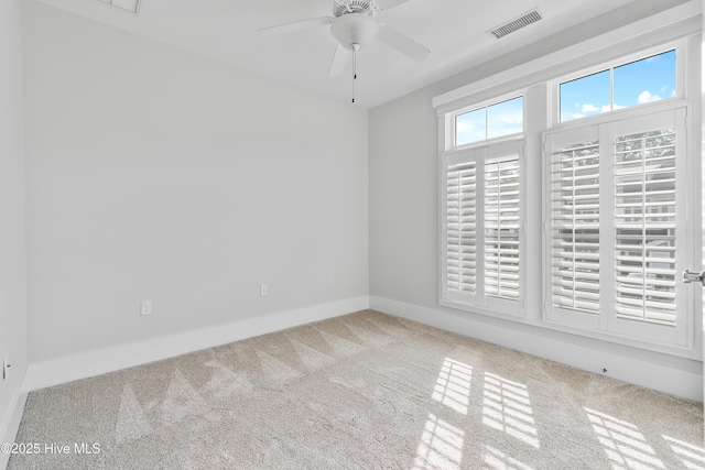 2537 St James Dr SE Apt 1011, Southport, NC 28461 - carpeted spare room featuring baseboards, visible vents, and ceiling fan