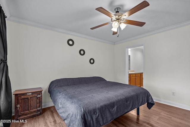 bedroom with connected bathroom, ceiling fan, baseboards, ornamental molding, and wood finished floors