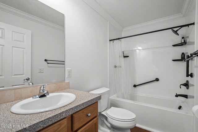 full bath featuring toilet, vanity, ornamental molding, and shower / bathtub combination with curtain