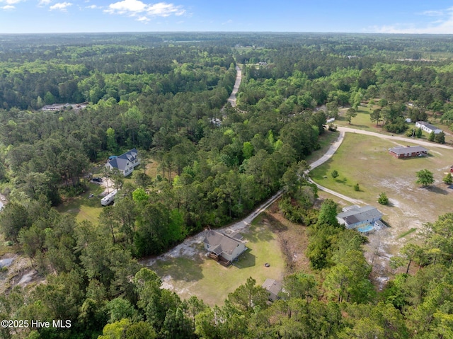 aerial view featuring a view of trees