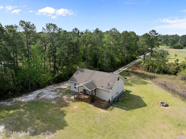 bird's eye view featuring a wooded view