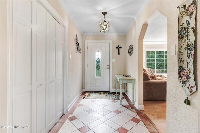 105 Harbor Dr, Washington, NC 27889 - foyer entrance with arched walkways, baseboards, ornamental molding, and light tile patterned floors
