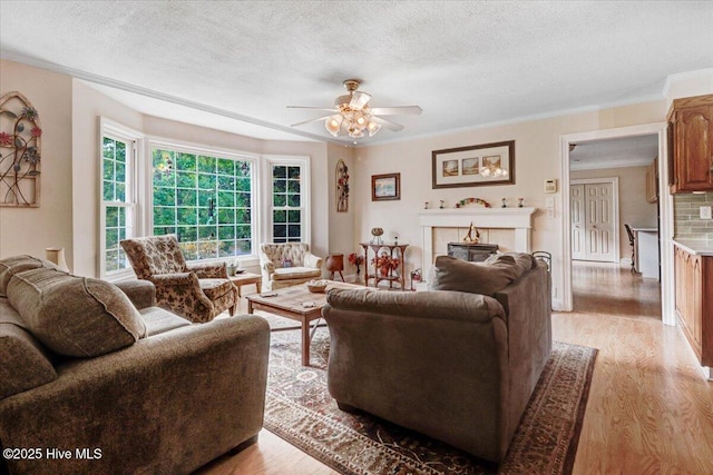 105 Harbor Dr, Washington, NC 27889 - living area featuring a textured ceiling, light wood finished floors, and ceiling fan
